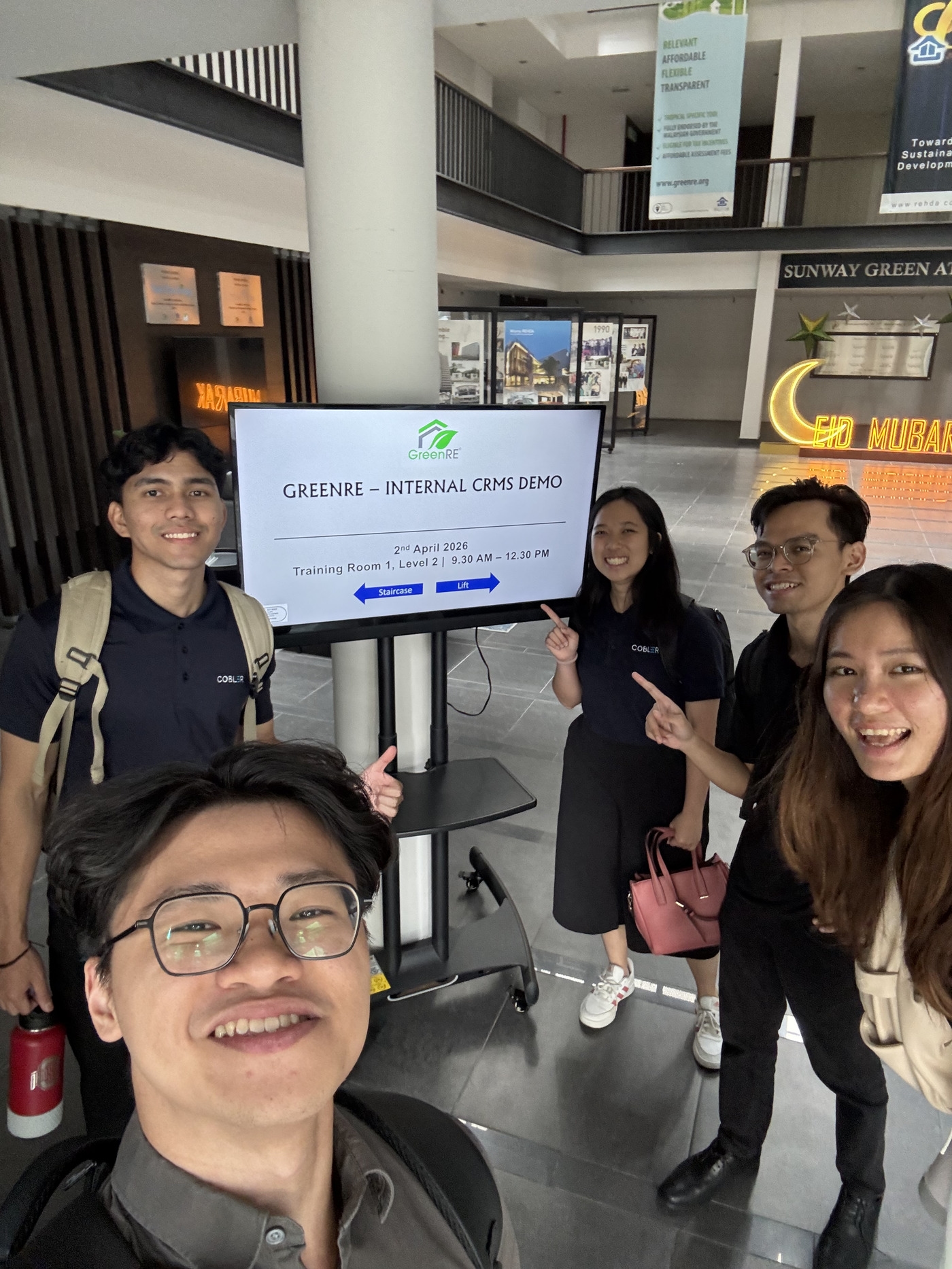 Cobler team demonstrating the GreenRE CRMS at GreenRE's office