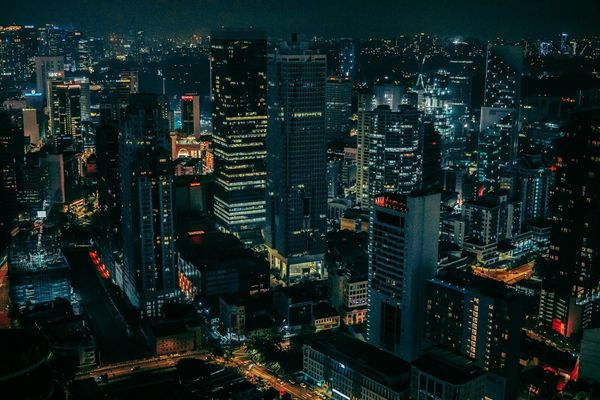 A dense city skyline lit up at night