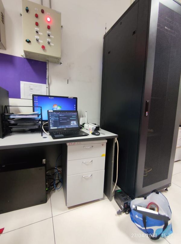 On-site server rack and laptop during building system commissioning